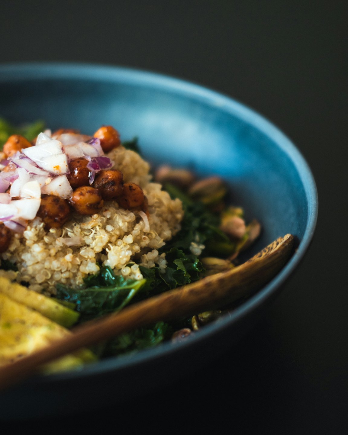 Healthy grain bowl with quinoa, kale, and chickpeas.